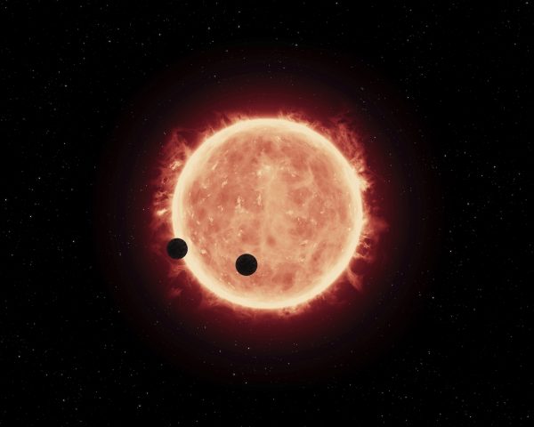 Artist’s impression of Earth-sized planets orbiting a red dwarf star. (Image: NASA, ESA, and G.Bacon (STScI))